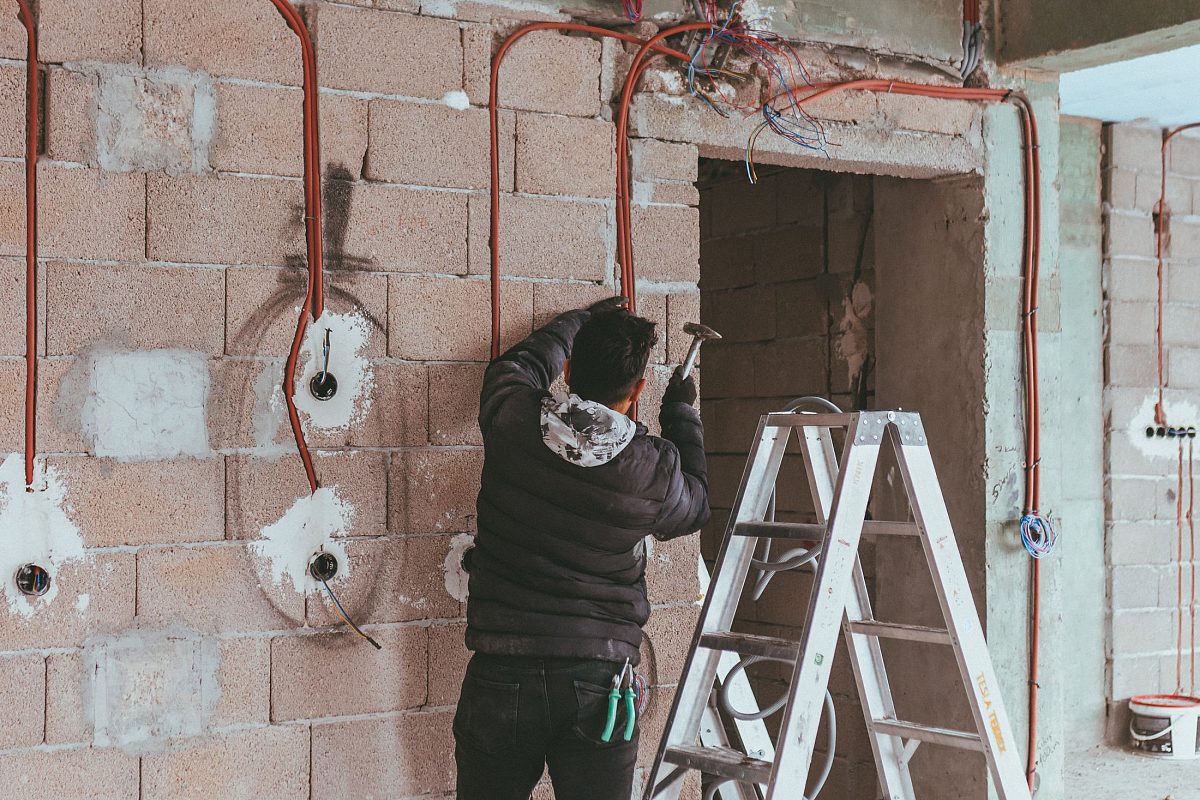 Electrician working on a domestic installation during a home visit